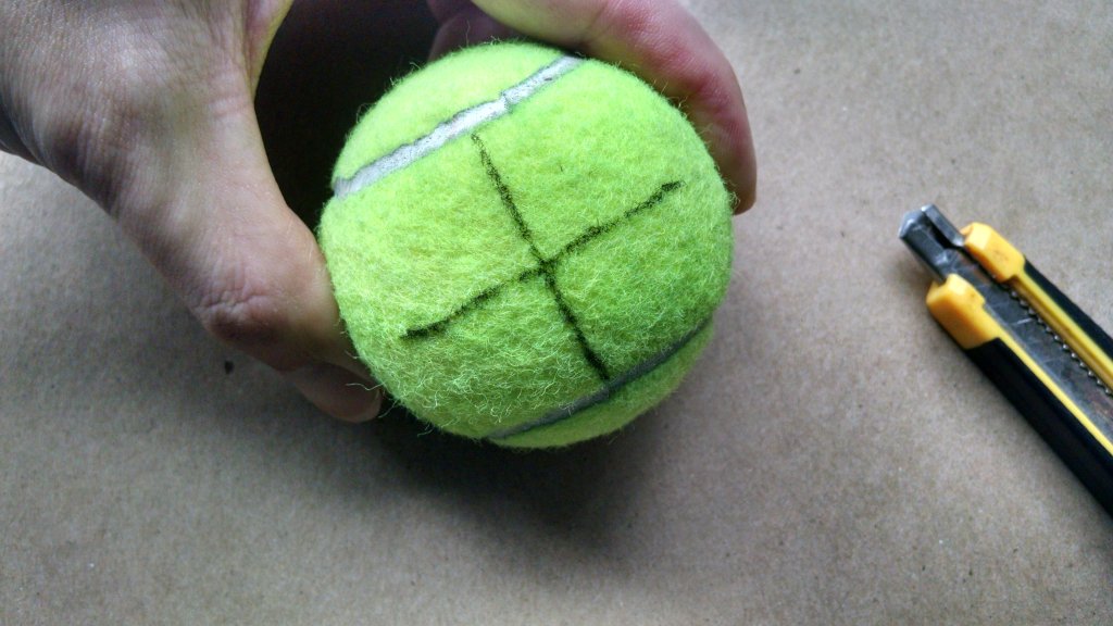 Holding Tennis Ball for Cutting