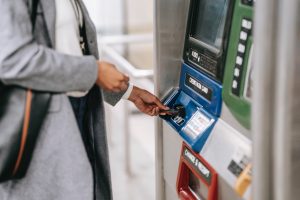 Woman Using Card at ATM