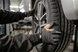 Tire Technician Changing Tire